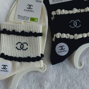 2 Pair of socks. 1 Cream trimmed in Black, 1 Black trimmed In Cream Women Size 7